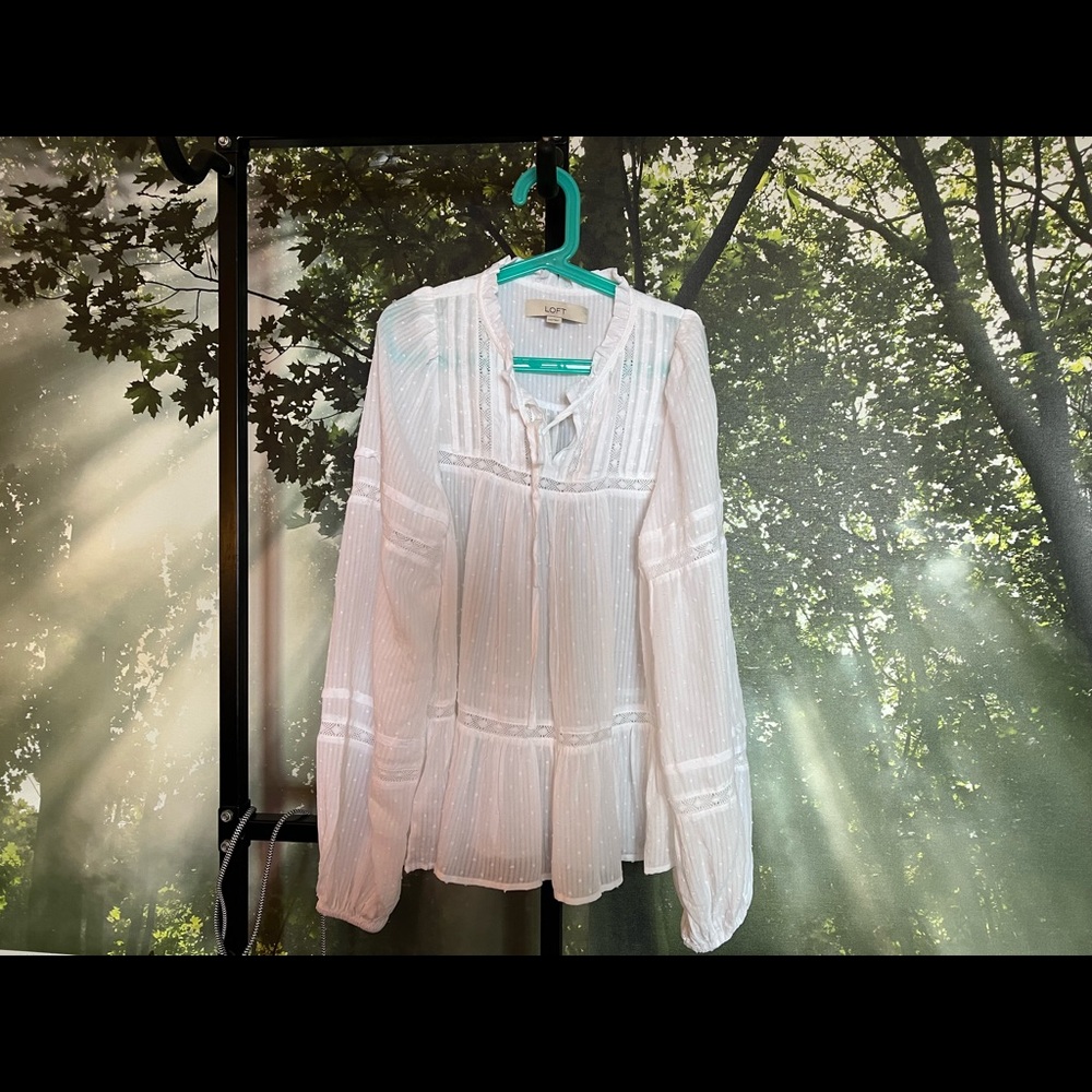 Beautiful white blouse with long sleeves and details